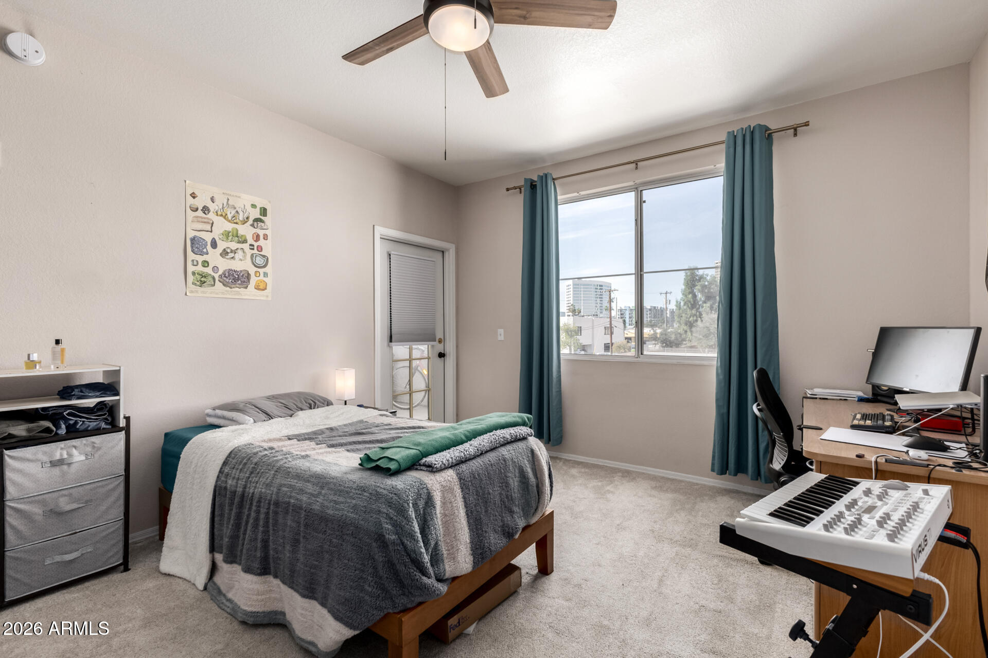 3302 North 7th Street, Unit 232 Phoenix, AZ 85014 - Photo 11 of 47 a bedroom with a bed and a window