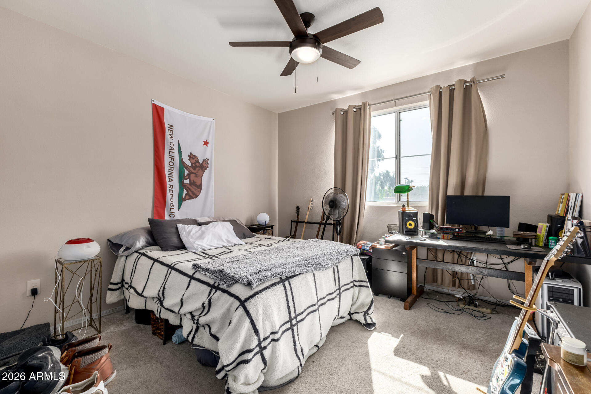 3302 North 7th Street, Unit 232 Phoenix, AZ 85014 - Photo 15 of 47 a bedroom that has a bed and a desk in it