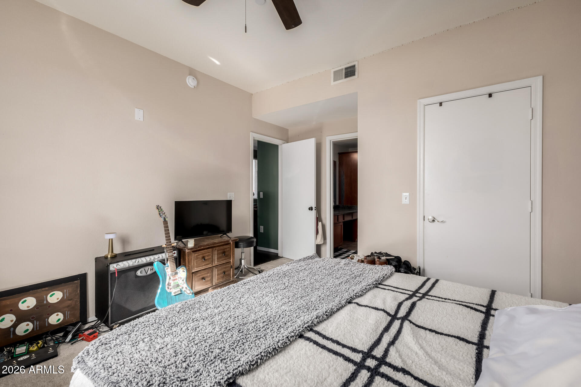 3302 North 7th Street, Unit 232 Phoenix, AZ 85014 - Photo 16 of 47 a bedroom with a bed and a flat screen tv