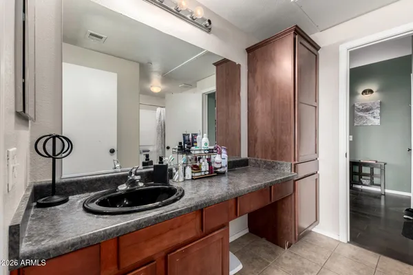 a bathroom with a sink and a mirror
