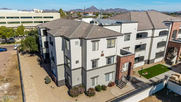 an aerial view of residential houses with outdoor space