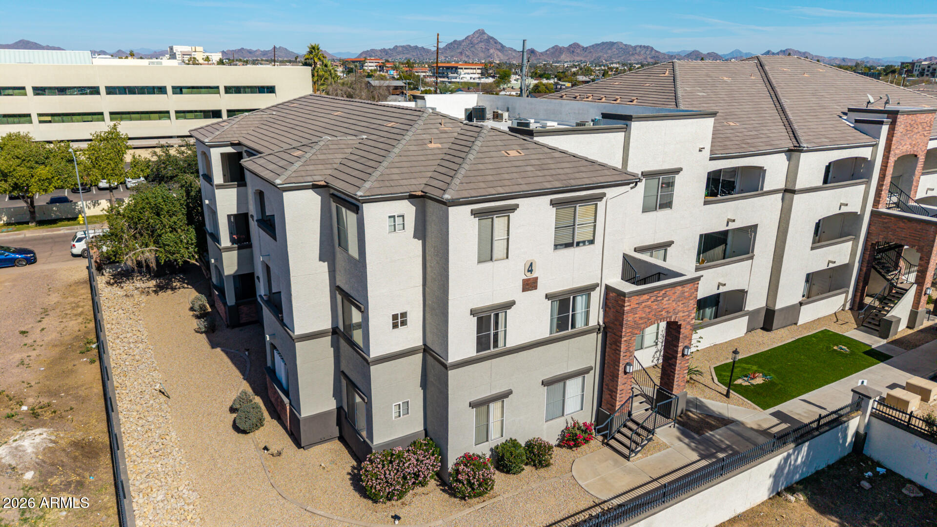 3302 North 7th Street, Unit 232 Phoenix, AZ 85014 - Photo 28 of 47 an aerial view of residential houses with outdoor space