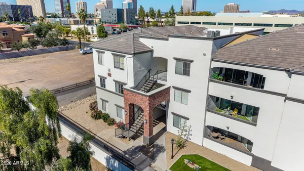 a aerial view of a house with a yard