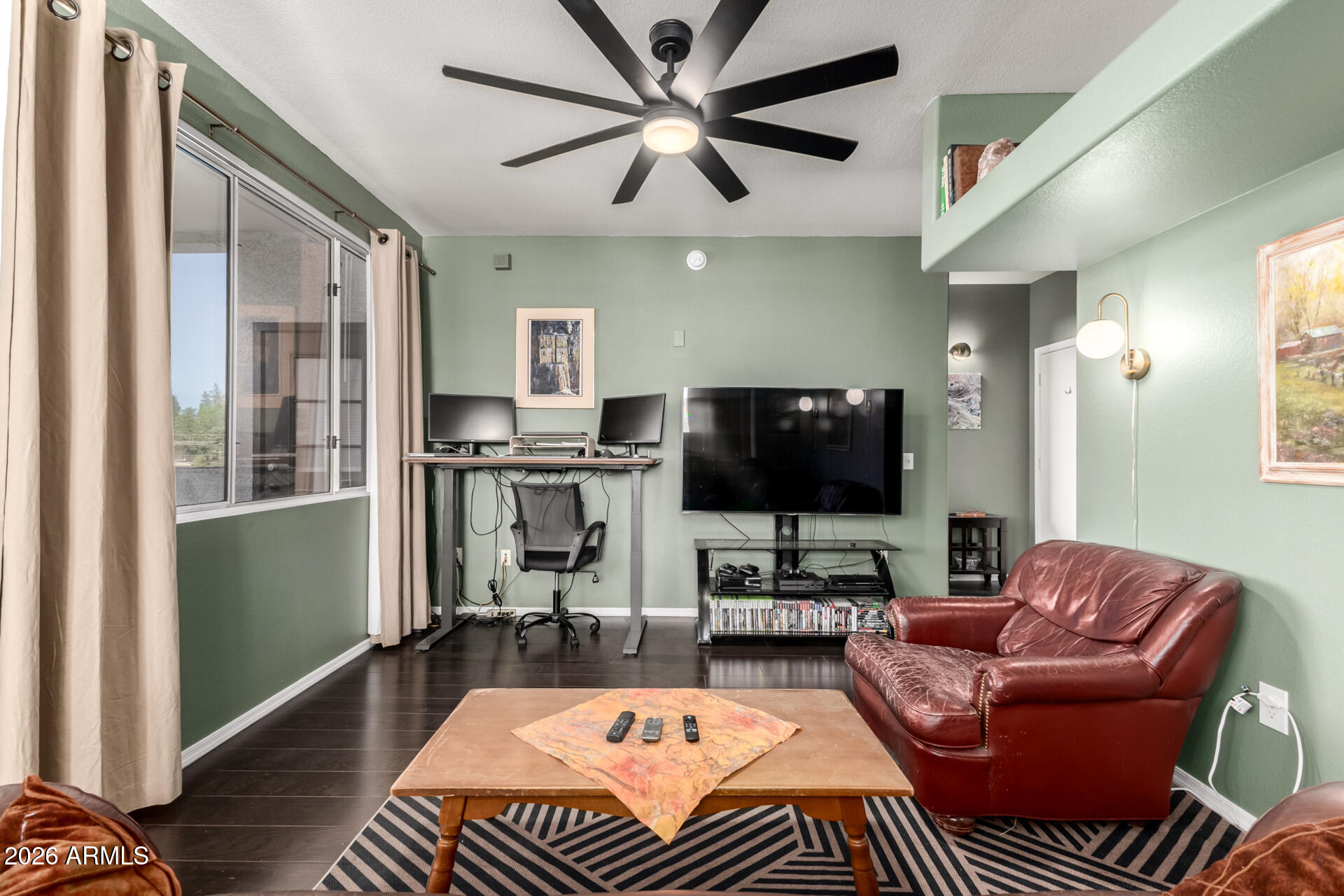 3302 North 7th Street, Unit 232 Phoenix, AZ 85014 - Photo 3 of 47 a living room with furniture and a flat screen tv