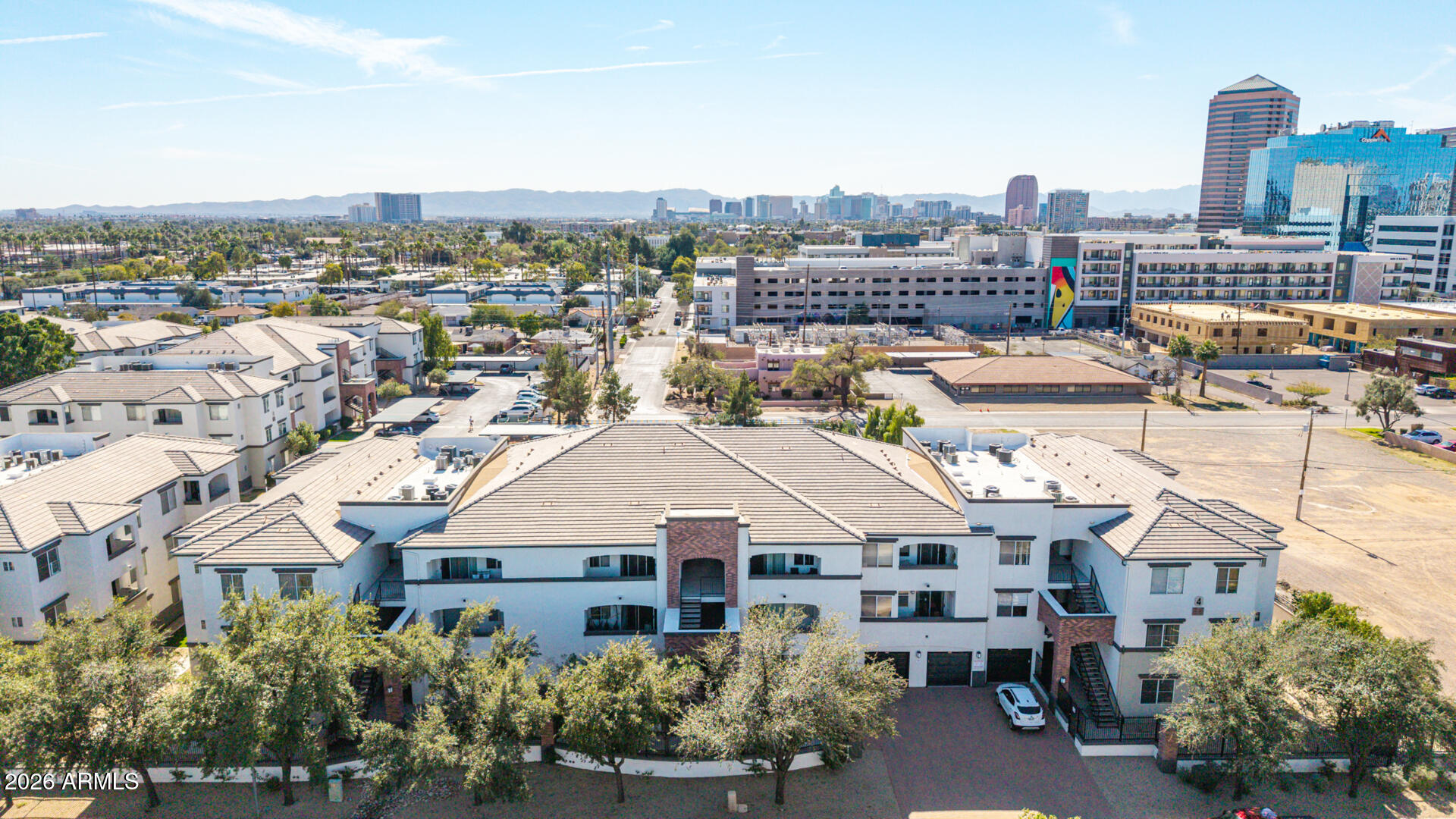 3302 North 7th Street, Unit 232 Phoenix, AZ 85014 - Photo 40 of 47 a aerial view of a residential apartment building with a yard