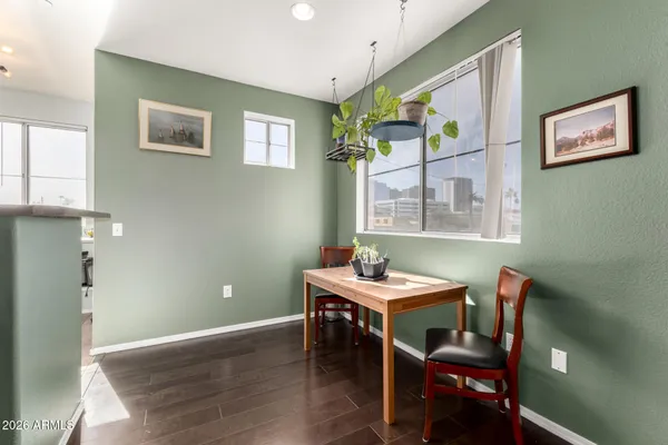 a view of a dining room with furniture window and wooden floor