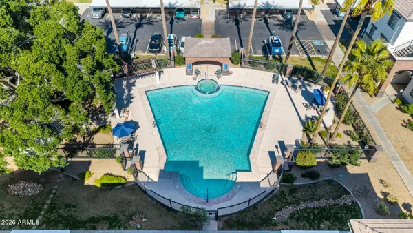 a view of swimming pool with outdoor seating