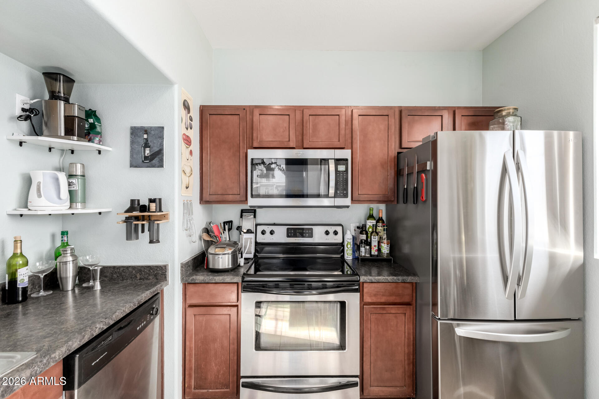 3302 North 7th Street, Unit 232 Phoenix, AZ 85014 - Photo 7 of 47 a kitchen with a refrigerator stove and microwave