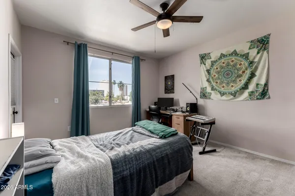 a bedroom that has a bed and a window