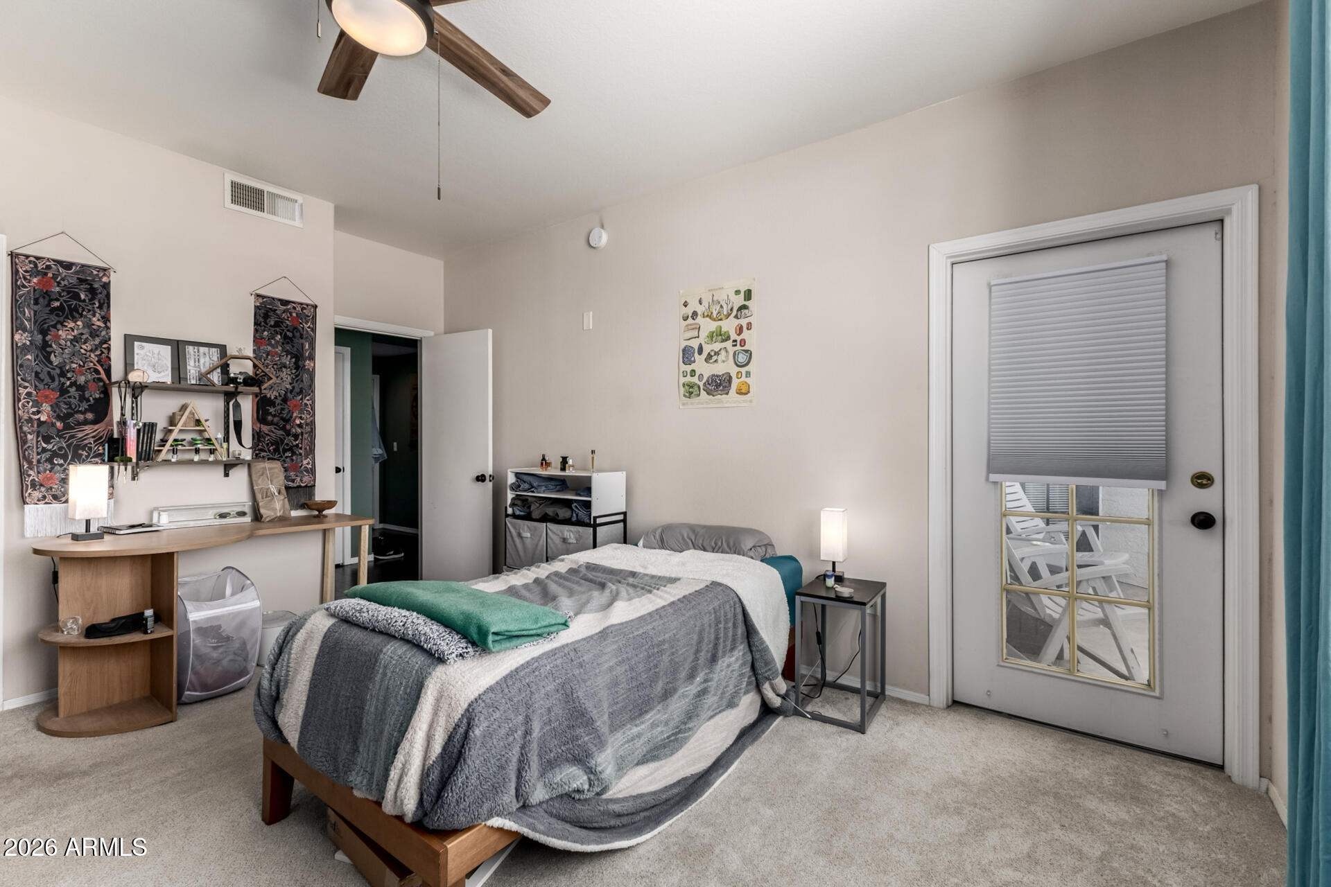 3302 North 7th Street, Unit 232 Phoenix, AZ 85014 - Photo 10 of 47 a bedroom with a bed closet and flat tv screen