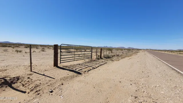 a view of ocean beach and mountain