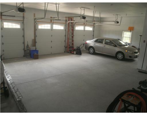 203 Old Snake Hill Road Glocester, RI 02814 - Photo 10 of 10 Parking Lot/Garage. 3 car garage with high ceilings with room for your tools