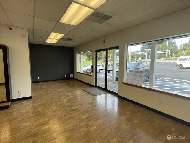 a view of a livingroom with an empty space and a fireplace