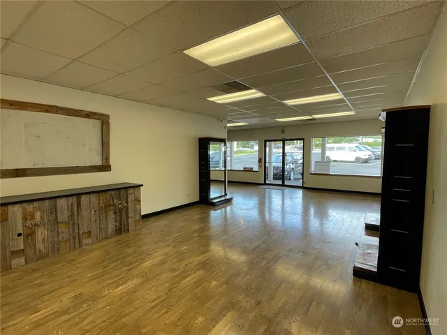 a view of a livingroom with wooden floor