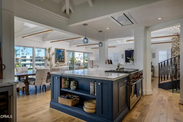 a kitchen with stainless steel appliances granite countertop a stove and a refrigerator
