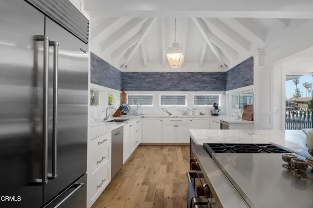 a kitchen with cabinets and a stove