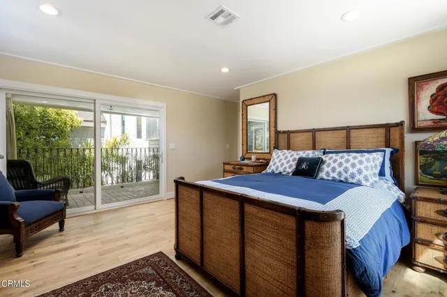 a bed room with a bed and a balcony