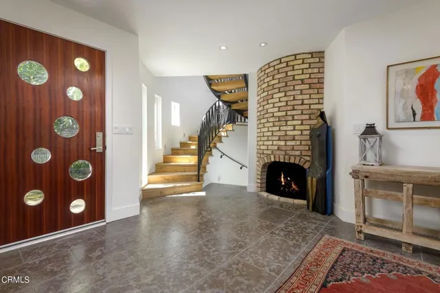 a view of an empty room with a fireplace