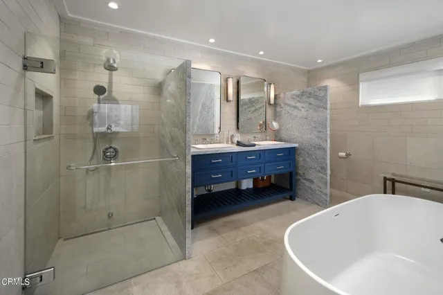a bathroom with a bathtub and shower