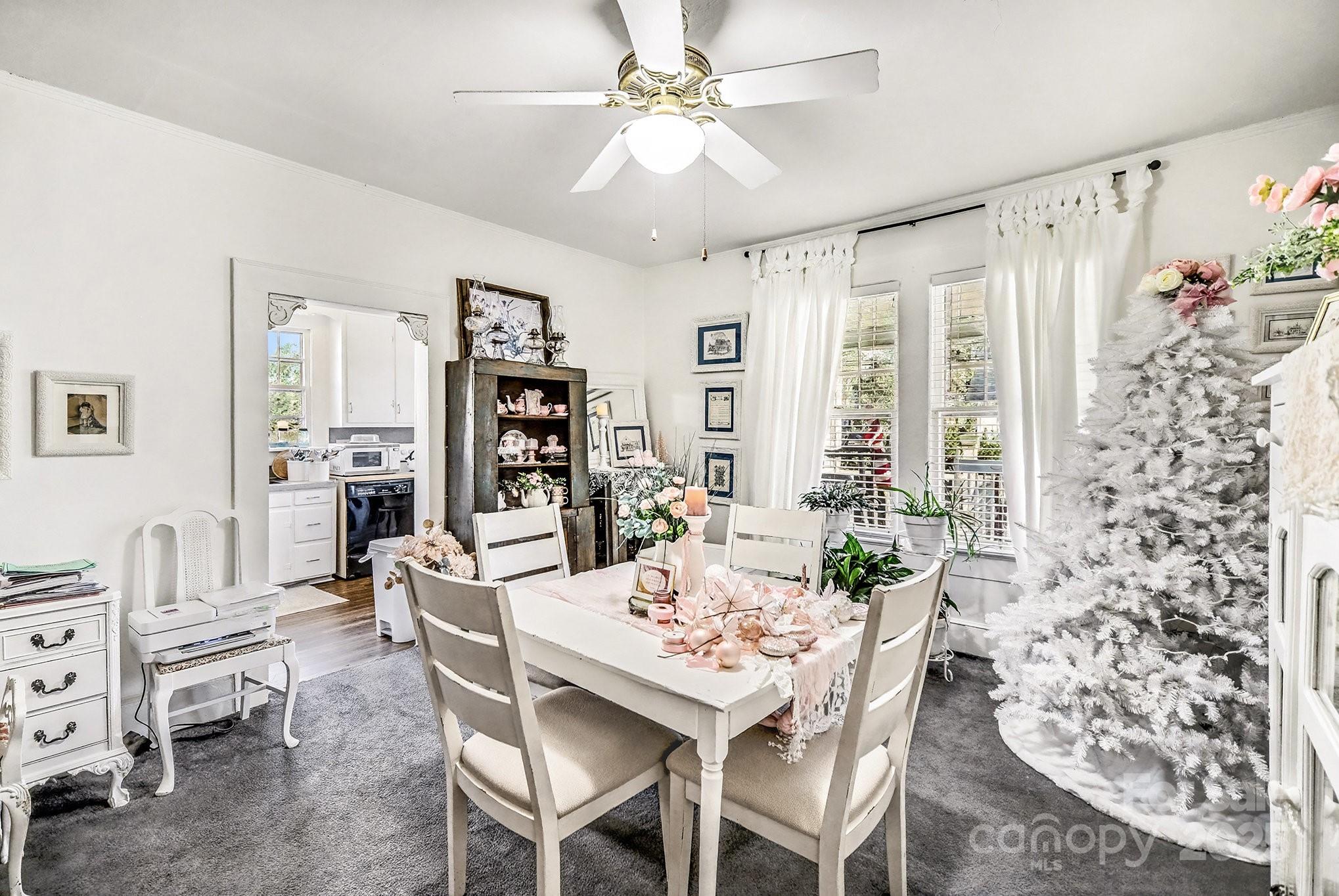352 Kerr Street Northwest Concord, NC 28025 - Photo 15 of 41 a view of a dining room with furniture and chandelier