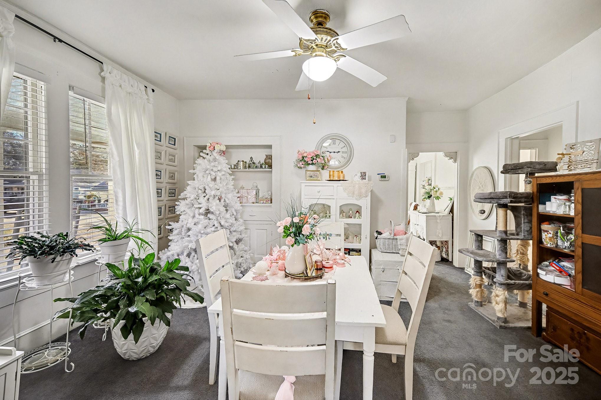 352 Kerr Street Northwest Concord, NC 28025 - Photo 17 of 41 a dining room with furniture and a potted plant