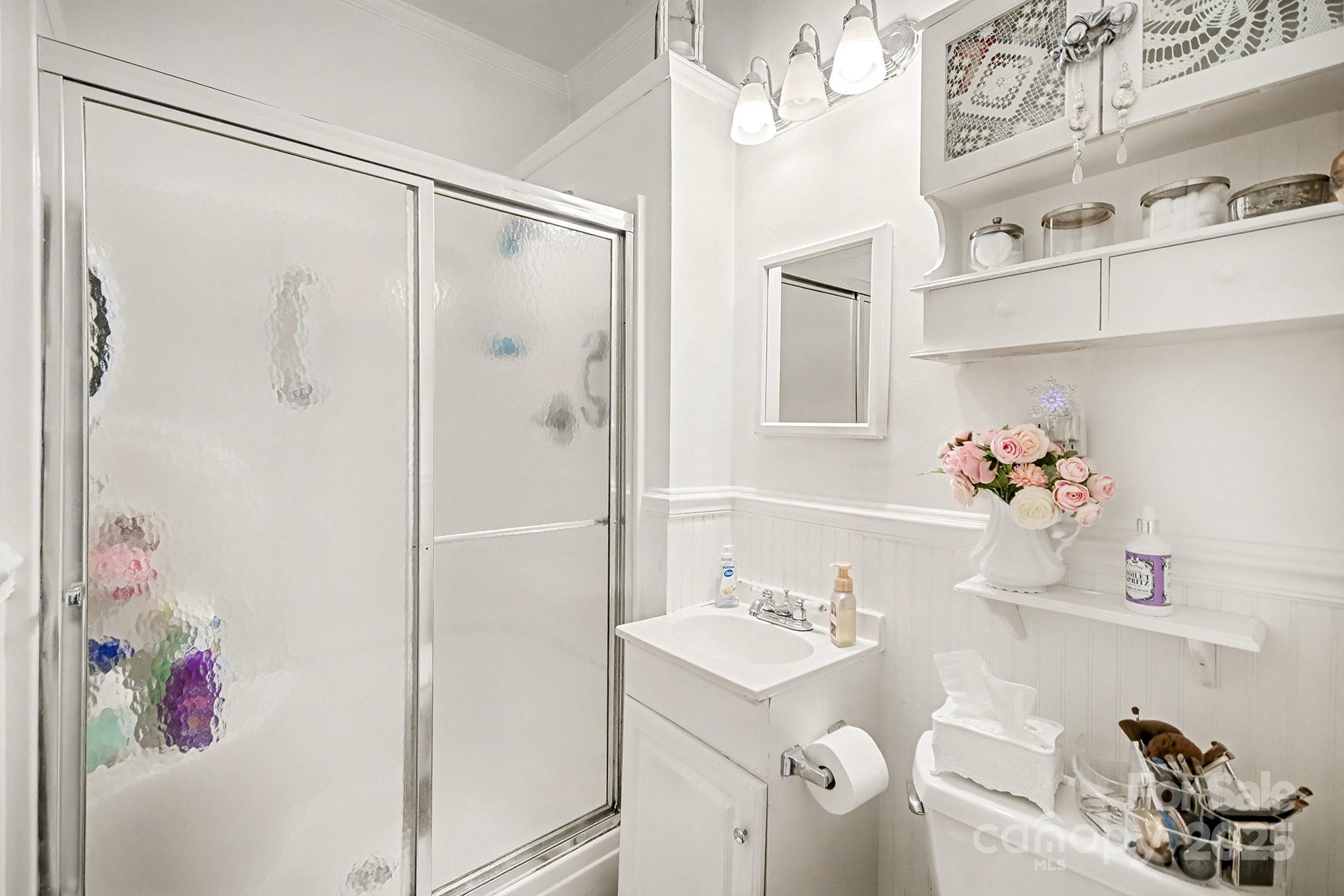 352 Kerr Street Northwest Concord, NC 28025 - Photo 26 of 41 a bathroom with a sink vanity mirror and shower