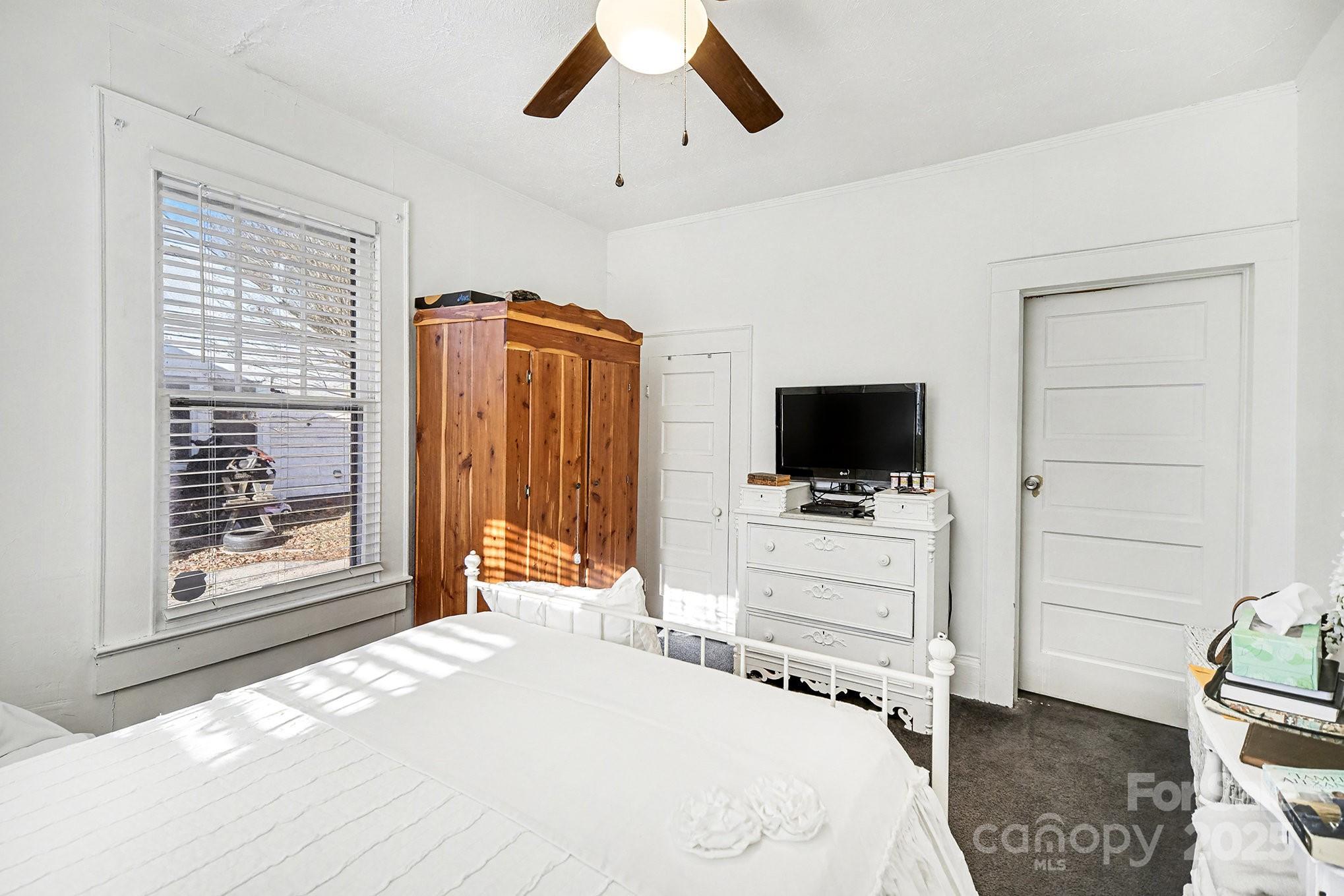 352 Kerr Street Northwest Concord, NC 28025 - Photo 28 of 41 a bedroom with a bed and a flat screen tv