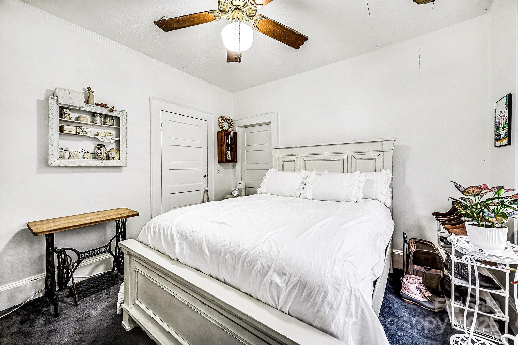 352 Kerr Street Northwest Concord, NC 28025 - Photo 33 of 41 a bedroom with a bed and a table in it