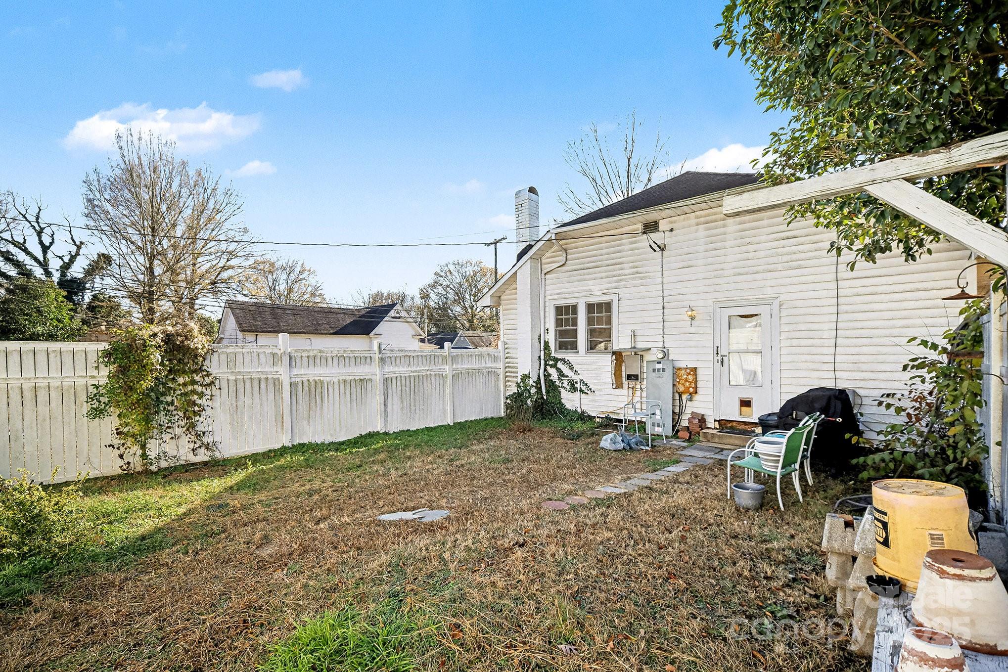 352 Kerr Street Northwest Concord, NC 28025 - Photo 40 of 41 a backyard of a house with table and chairs