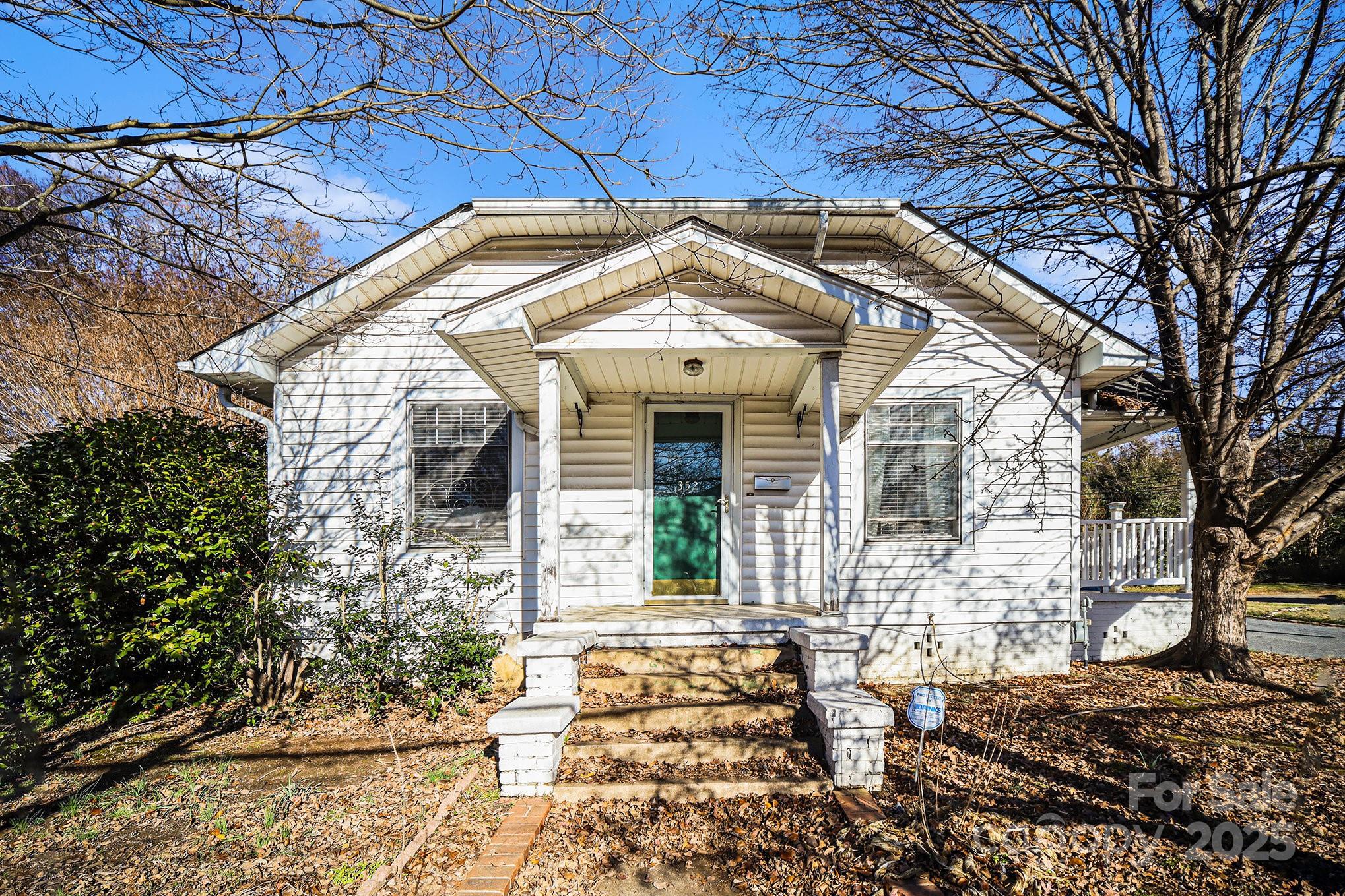 352 Kerr Street Northwest Concord, NC 28025 - Photo 6 of 41 a view of a brick house with large windows