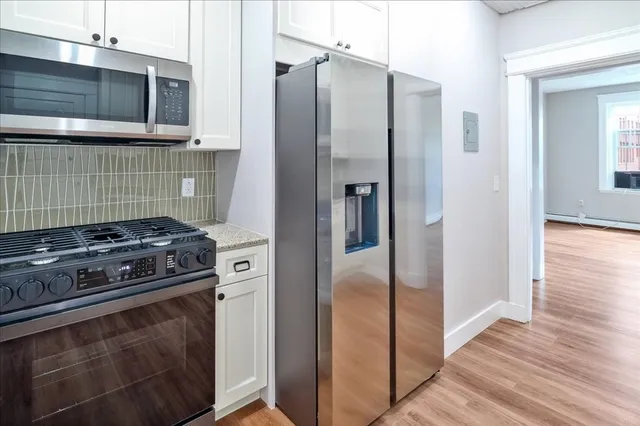 a kitchen with a stove and a microwave