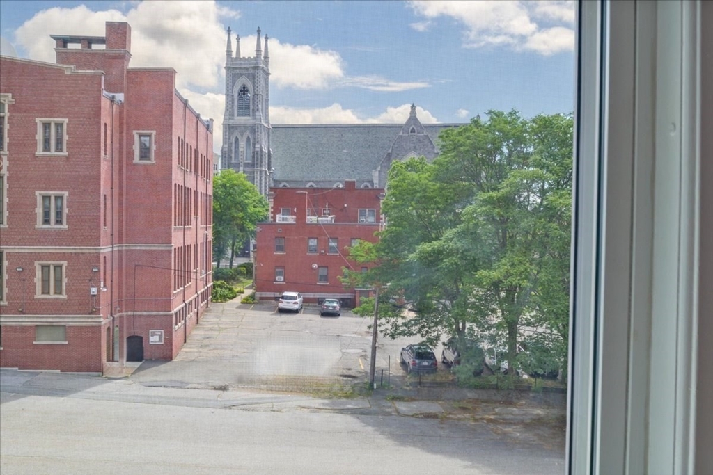 6 Chatham Place, Unit 6 Worcester, MA 01609 - Photo 13 of 31 a view of a brick building next to a yard