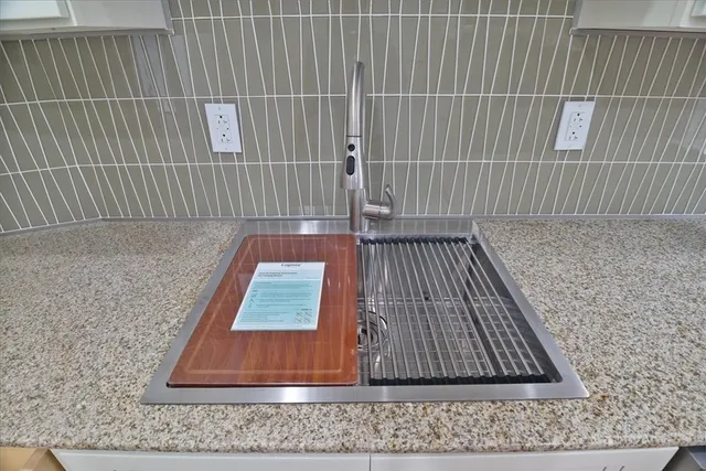 a close view of a utility room with dryer and washer