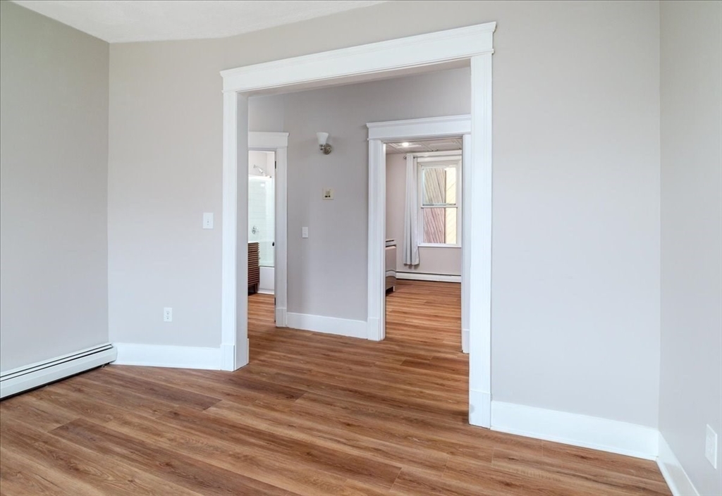 6 Chatham Place, Unit 6 Worcester, MA 01609 - Photo 10 of 31 a view of a hallway with wooden floor