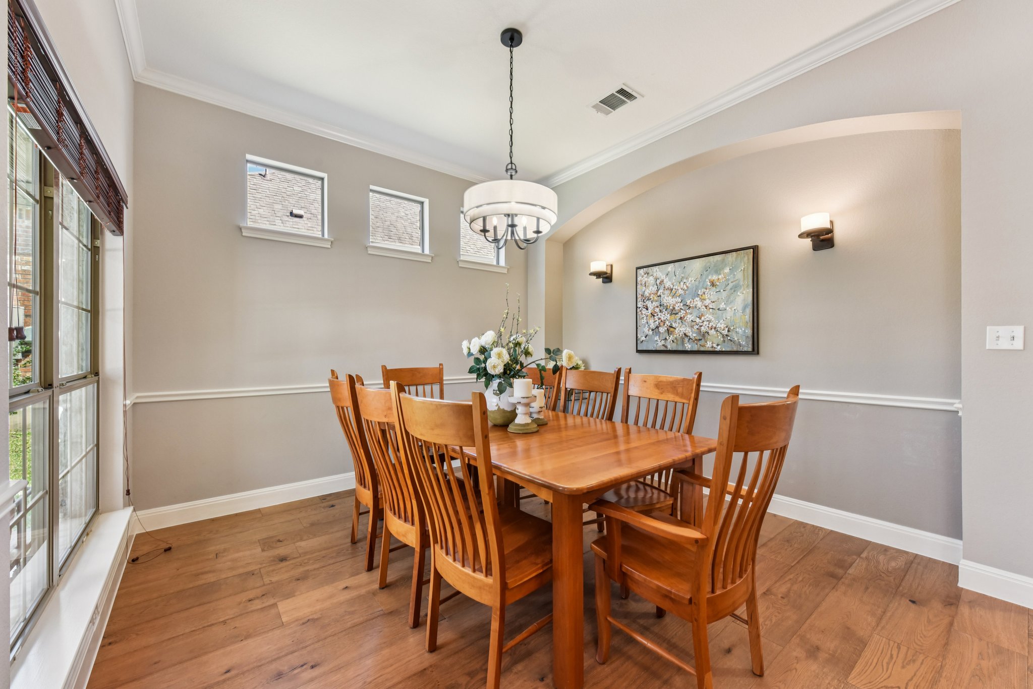 12913 Little Dipper Path Austin, TX 78732 - Photo 11 of 30 a dining room with furniture a chandelier and wooden floor