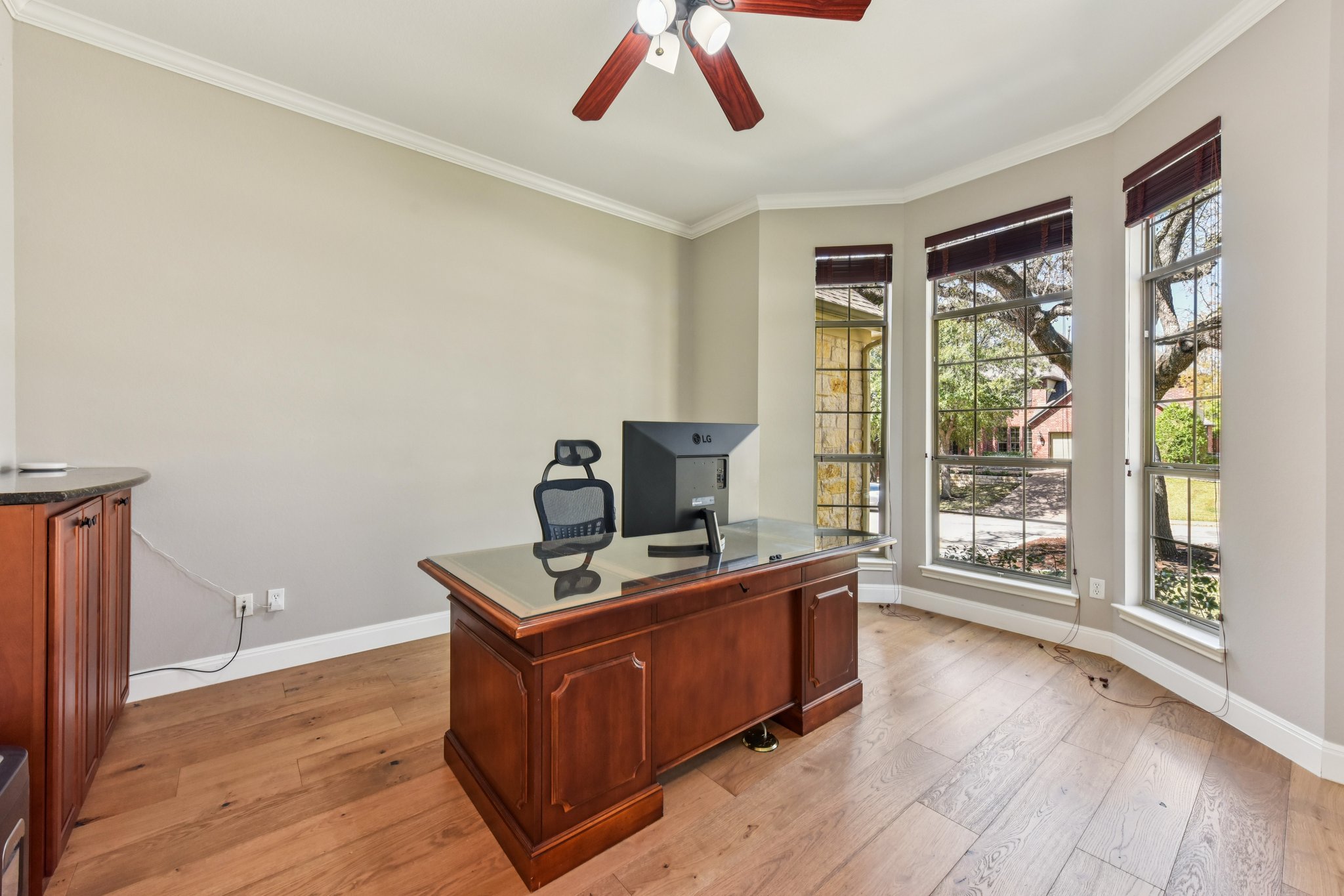 12913 Little Dipper Path Austin, TX 78732 - Photo 12 of 30 a room with a desk and wooden floor