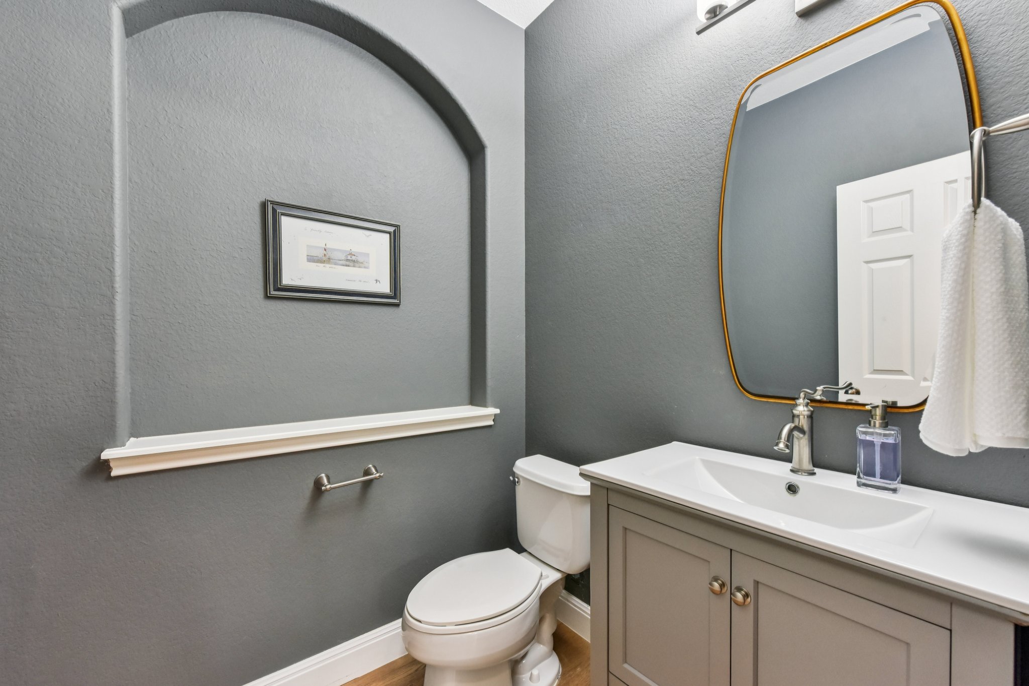 12913 Little Dipper Path Austin, TX 78732 - Photo 13 of 30 a bathroom with a toilet sink and mirror