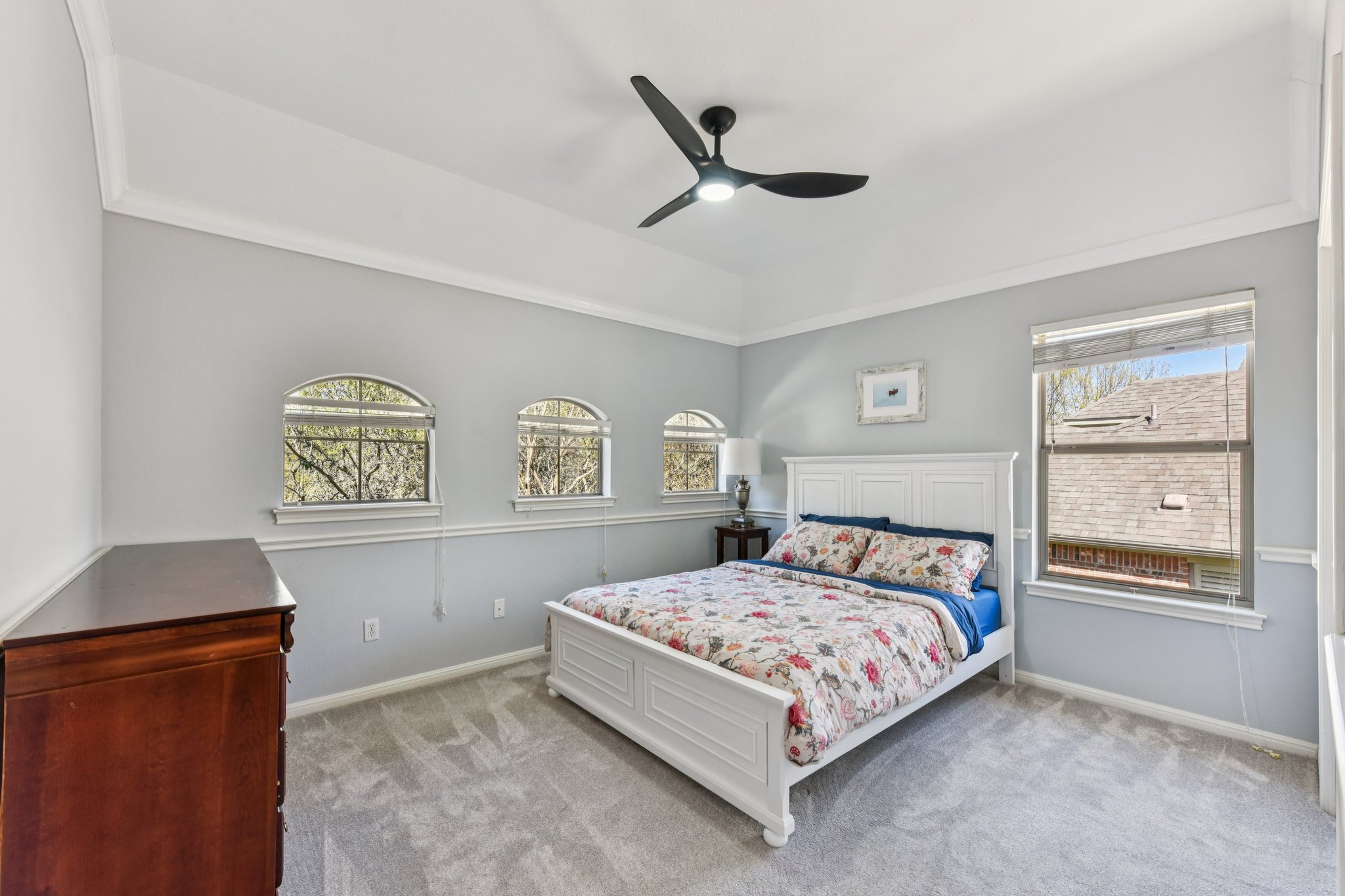12913 Little Dipper Path Austin, TX 78732 - Photo 14 of 30 a bedroom with a bed and a lamp on dresser