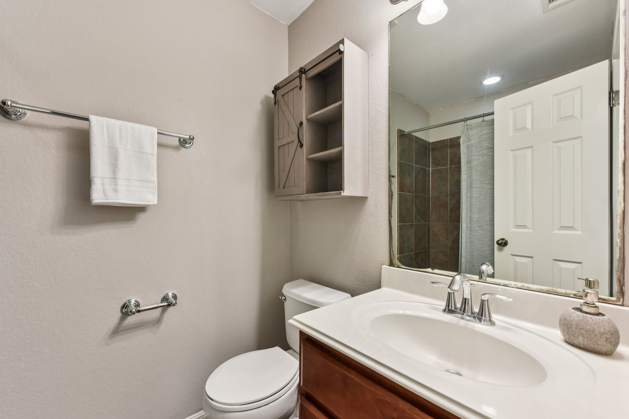 12913 Little Dipper Path Austin, TX 78732 - Photo 15 of 30 a bathroom with a sink toilet vanity and shower
