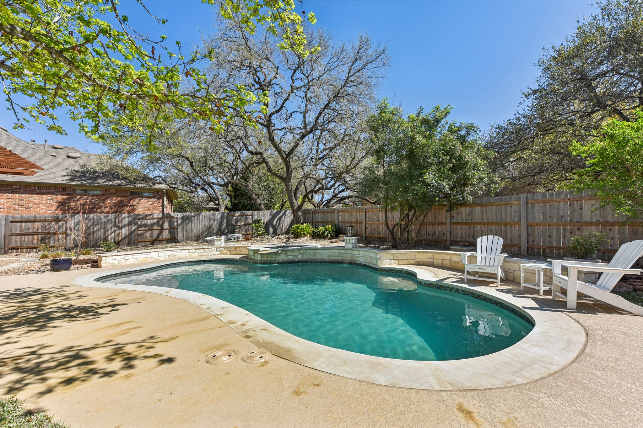 12913 Little Dipper Path Austin, TX 78732 - Photo 19 of 30 a view of a swimming pool with a backyard