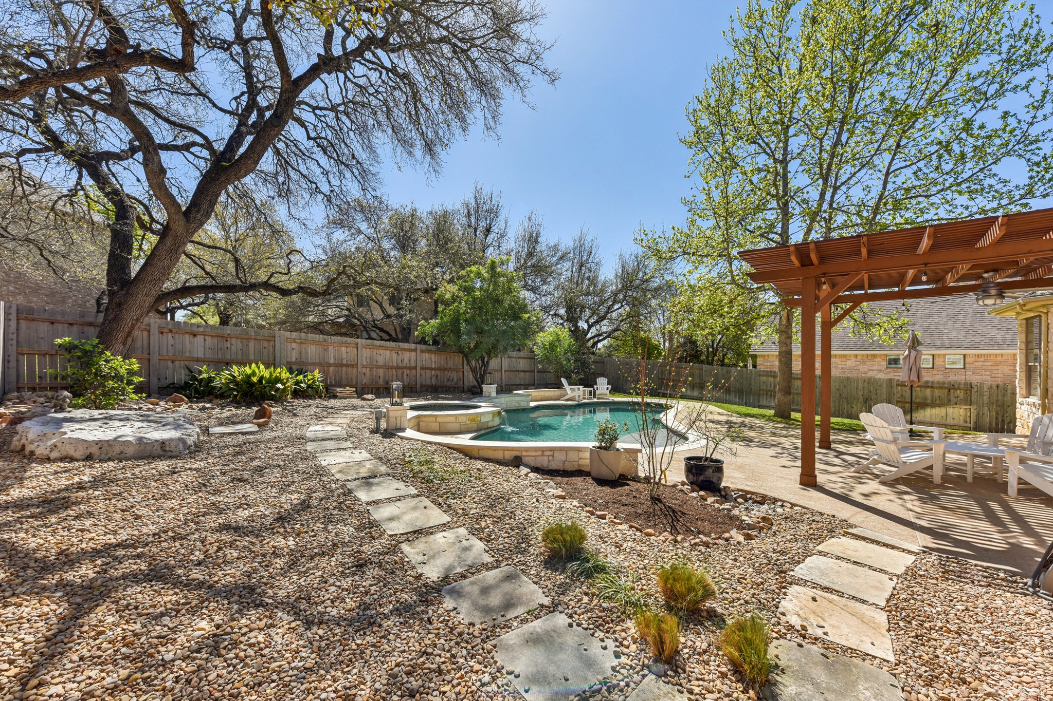 12913 Little Dipper Path Austin, TX 78732 - Photo 20 of 30 a view of a house with backyard and sitting area