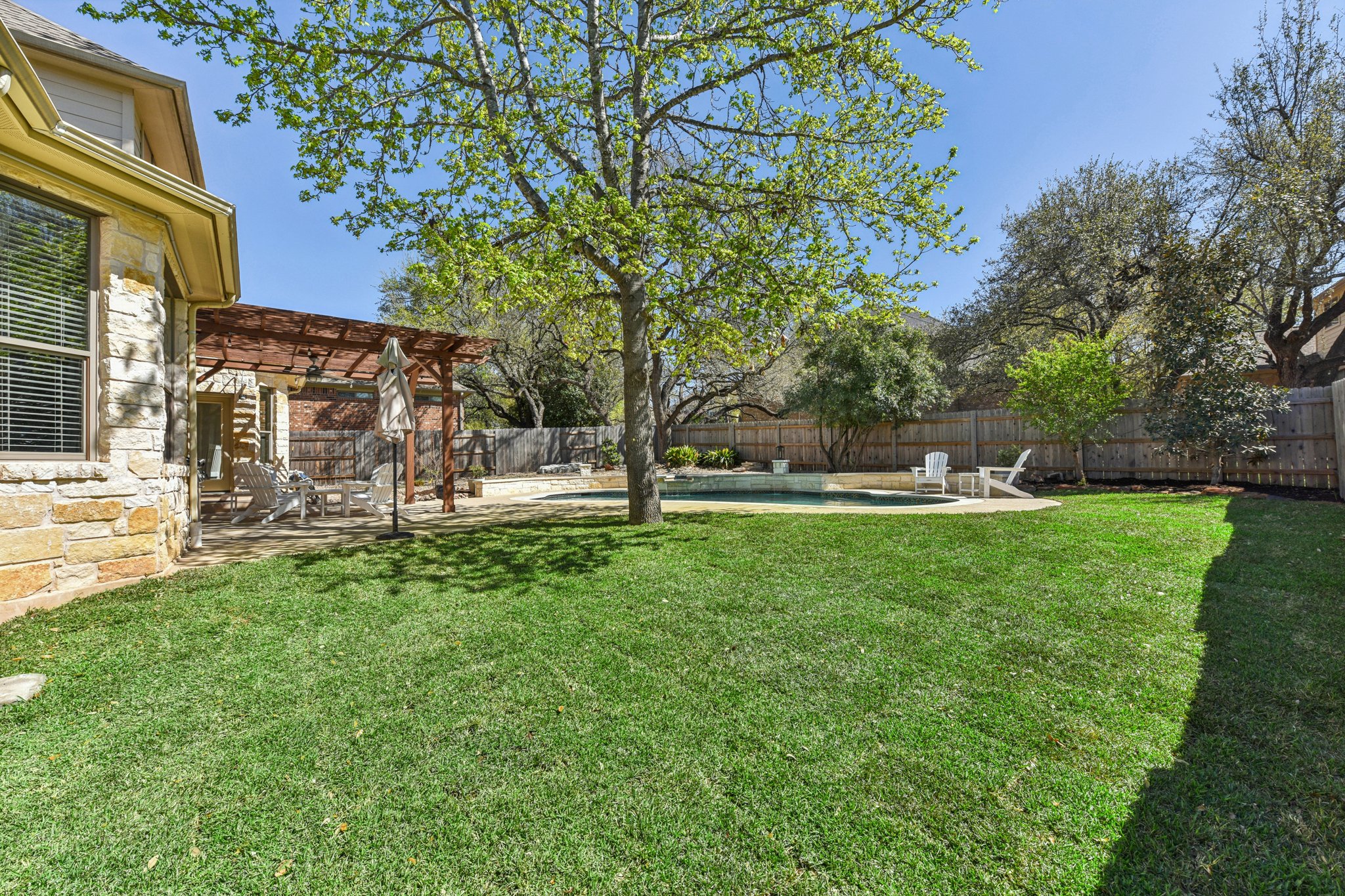 12913 Little Dipper Path Austin, TX 78732 - Photo 22 of 30 a view of a house with a yard