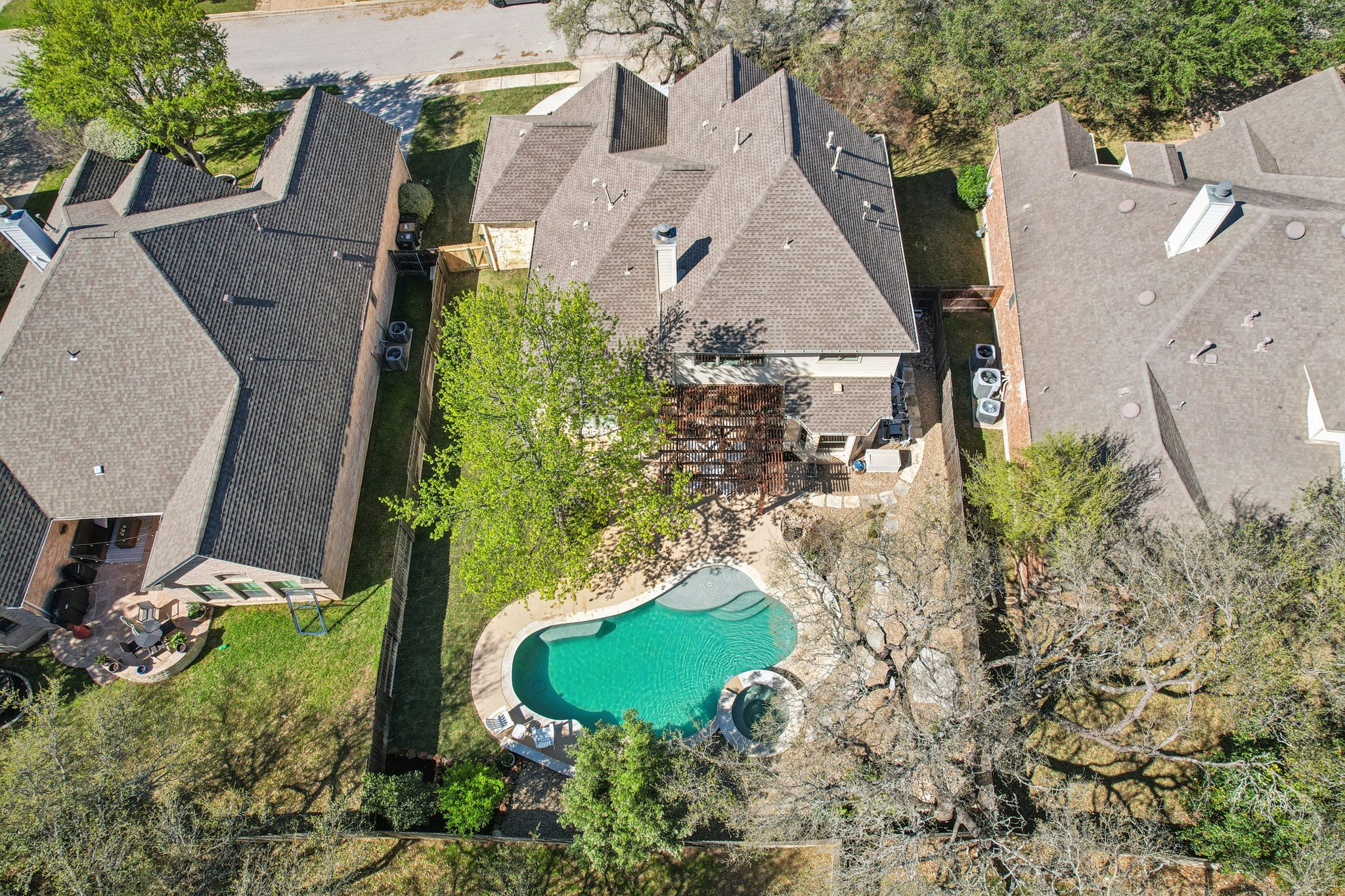 12913 Little Dipper Path Austin, TX 78732 - Photo 23 of 30 an aerial view of a house with a yard and a fountain