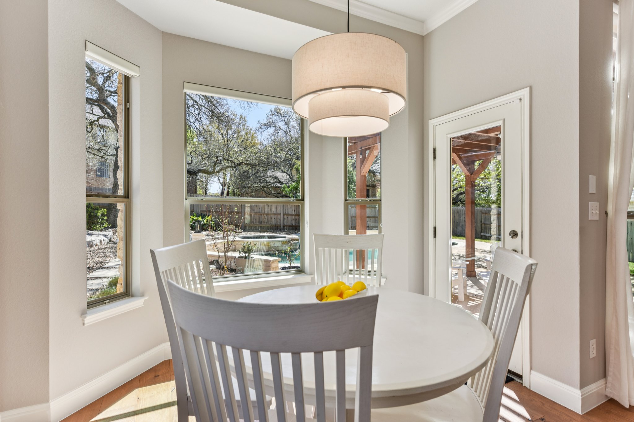 12913 Little Dipper Path Austin, TX 78732 - Photo 6 of 30 a view of a dining room with furniture window and outside view