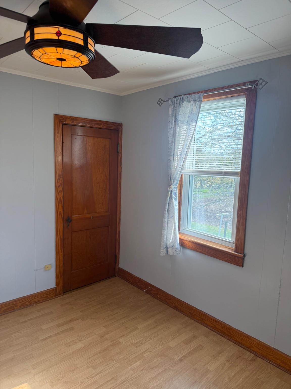 10899 Fish And Game Road, Unit 2 Waynesboro, PA 17268 - Photo 12 of 24 an empty room with a window and lamp