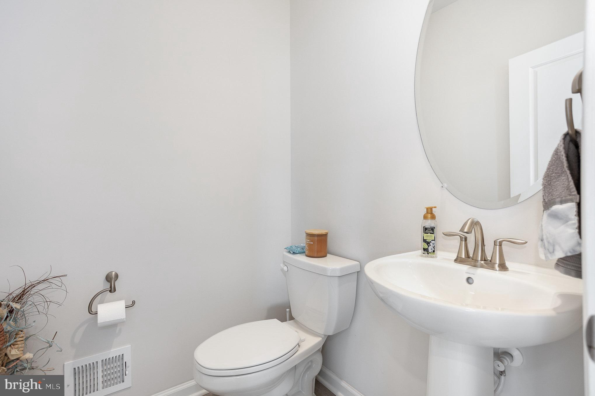 10 Beech Ridge Lane York, PA 17404 - Photo 19 of 47 a white toilet sitting next to a bathroom sink