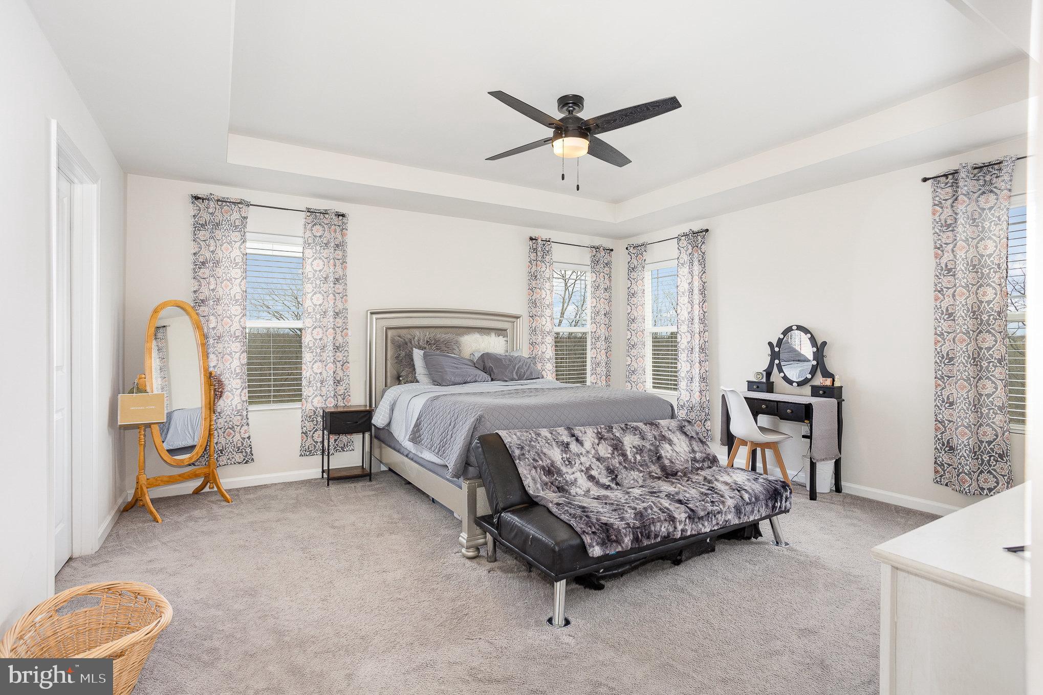 10 Beech Ridge Lane York, PA 17404 - Photo 20 of 47 a bedroom with a bed and a chandelier