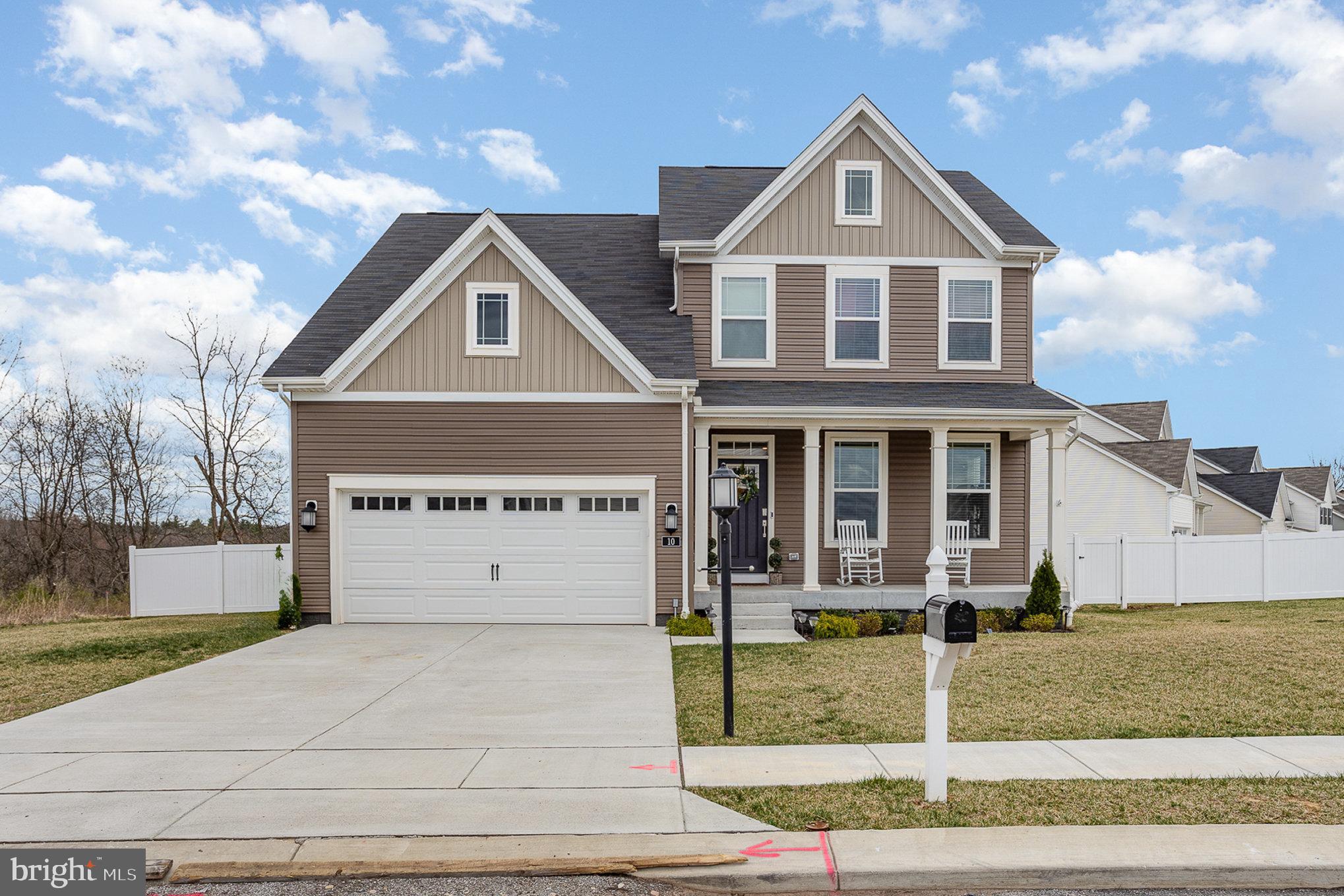 10 Beech Ridge Lane York, PA 17404 - Photo 2 of 47 a front view of a house with a yard and garage