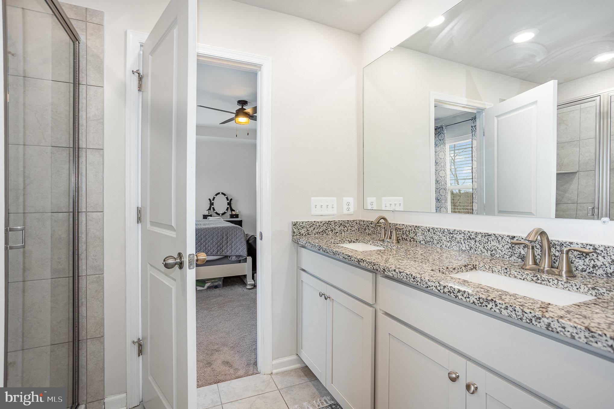 10 Beech Ridge Lane York, PA 17404 - Photo 24 of 47 a en suite bathroom with a granite countertop sink and a mirror