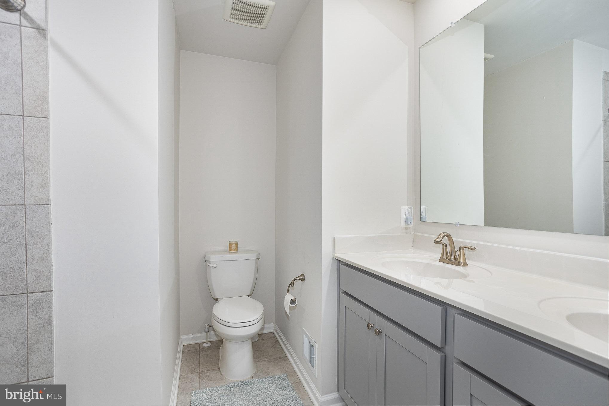 10 Beech Ridge Lane York, PA 17404 - Photo 33 of 47 a bathroom with a granite countertop toilet a sink and a mirror